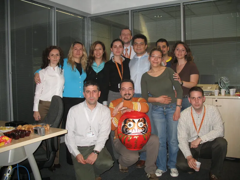Toshiba Global Support Center Operations Management team photo with Daruma at Siemens Business Services Kartal Istanbul Campus